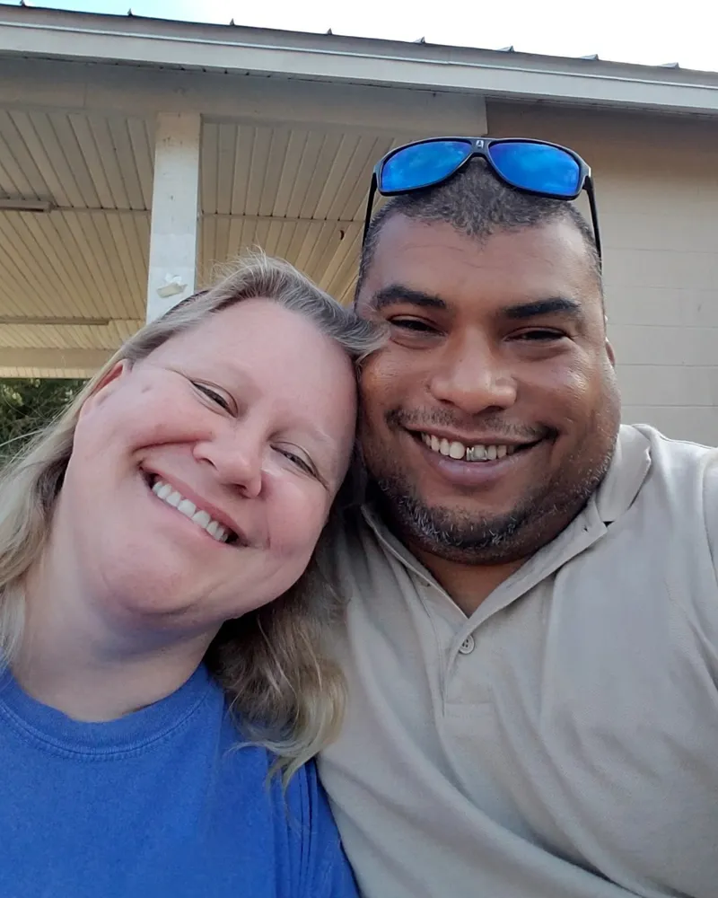 Greylynne and Fernando smiling together outdoors